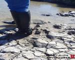 Highheeledleatherbootsinmuddywater