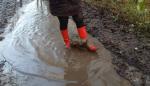 026.Redrubberbootsinthemud